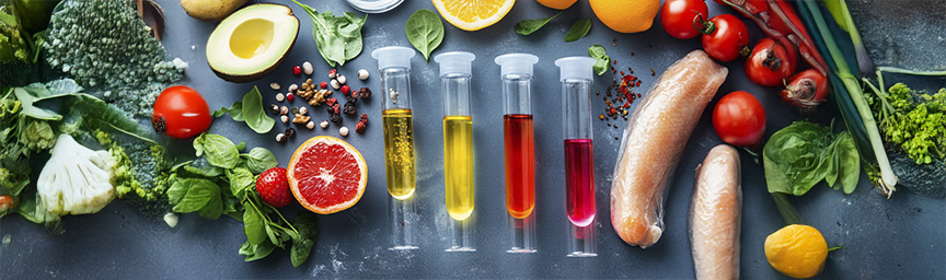 Fresh vegetables, fruits and vitamin test tubes for nutritional analysis